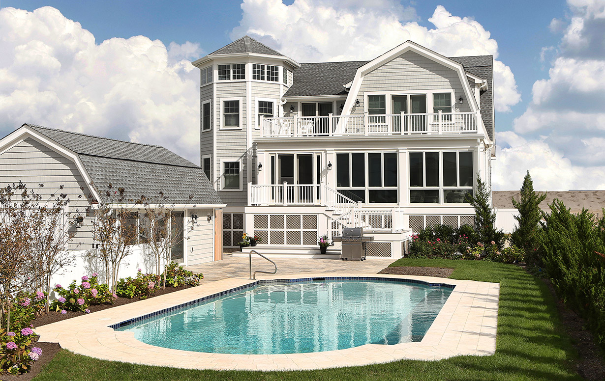 After the devastation of Hurricane Sandy destroyed the original beach bungalow, the Lasley Brahaney team
                designed and built this new home to suit the modern needs of the owner, prioritizing views of both the
                shore and the bay.
