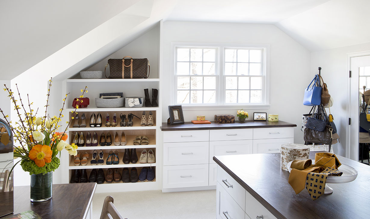 These homeowners had a classic home with charm in a great location, but the primary suite was extremely small. Our design-build team worked with them to re-organize existing space into a fully customized closet/dressing room and a gorgeous primary bath.