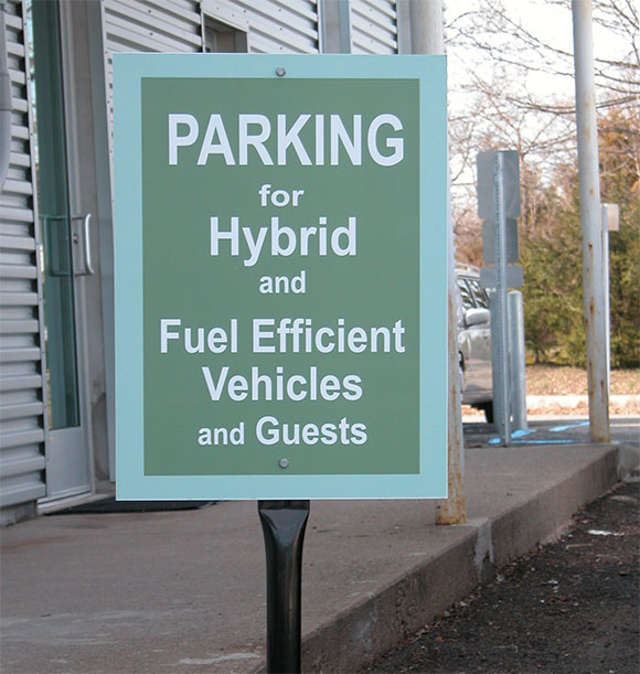 A shift in mentality: Lasley Brahaney provides special parking for those who use fuel efficient vehicles.