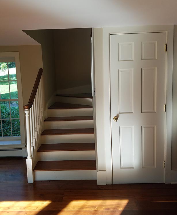 Before: The existing house ended behind the staircase. The door to the right opened to a linen closet.