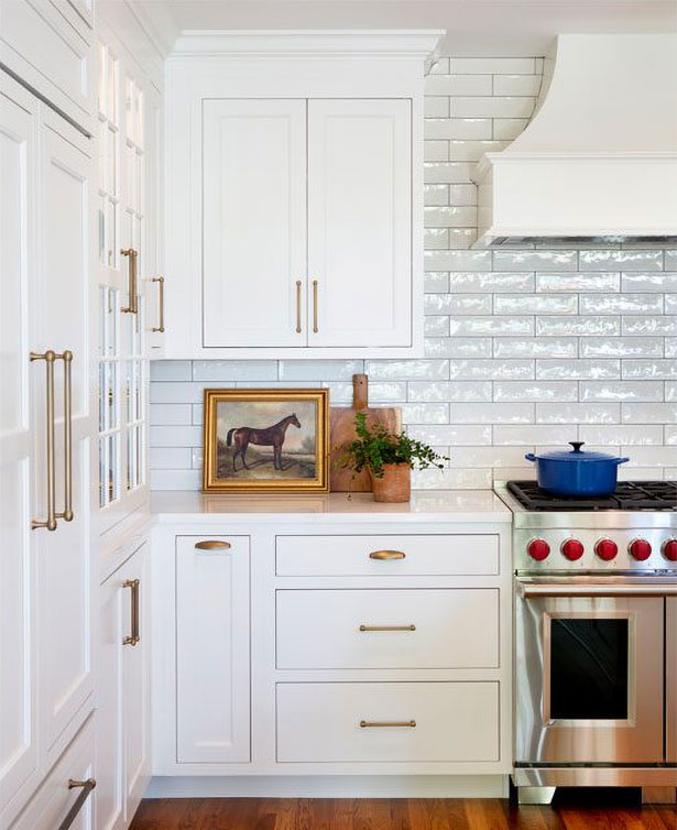 A doorway to the home’s foyer was closed up during the renovation to create an uninterrupted wall for cabinetry and a range.