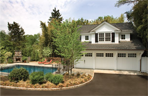 A three-car detached gargage was redesigned and rebuilt to inlude an excercise room and bathroom for the nearby pool (photo by Tom Grimes).