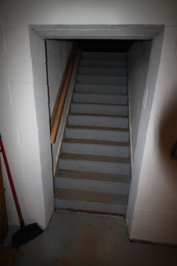 Basement stairs before renovation.  Photo: Becky Harris