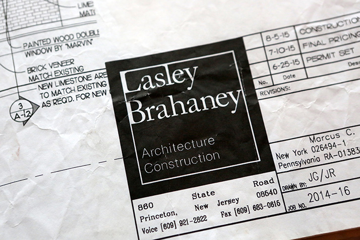 Blueprints showing the logo of building company Lasley Brahaney Architecture + Construction in Princeton, NJ