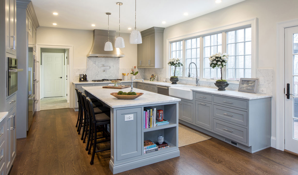 A grey kitchen island installed by architect firm Lasley Brahaney Architecture + Construction in Princeton, NJ