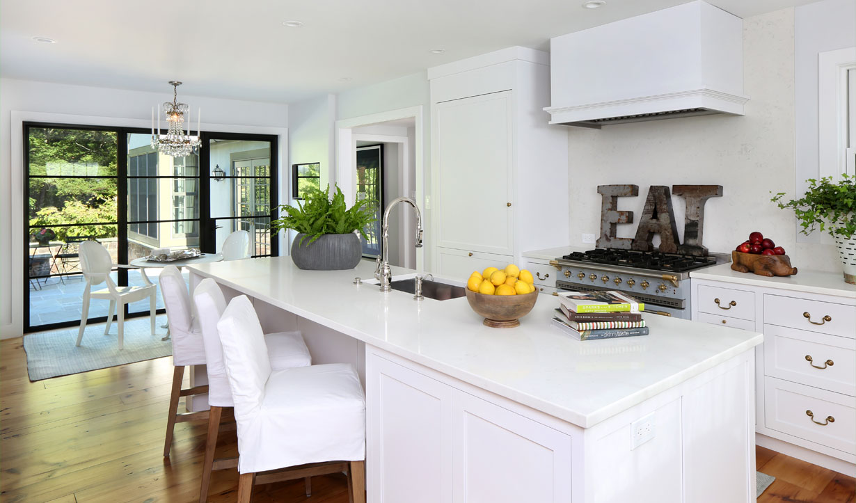 White, modern kitchen designed by construction company Lasley Brahaney Architecture + Construction in Princeton, NJ