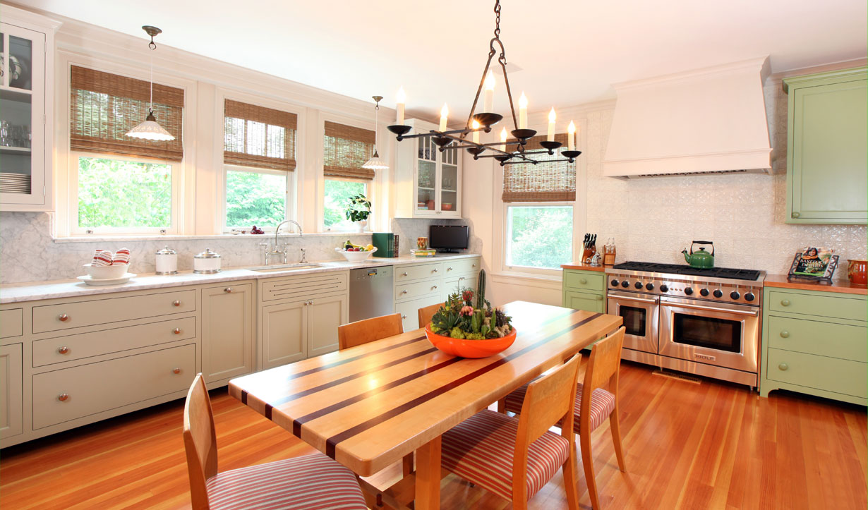 Kitchen with green and white cabinets redesigned by construction company Lasley Brahaney Architecture + Construction in Princeton, NJ