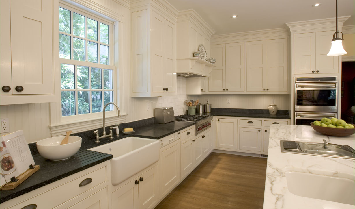 Spacious white kitchen redesigned by building company Lasley Brahaney Architecture + Construction in Princeton, NJ