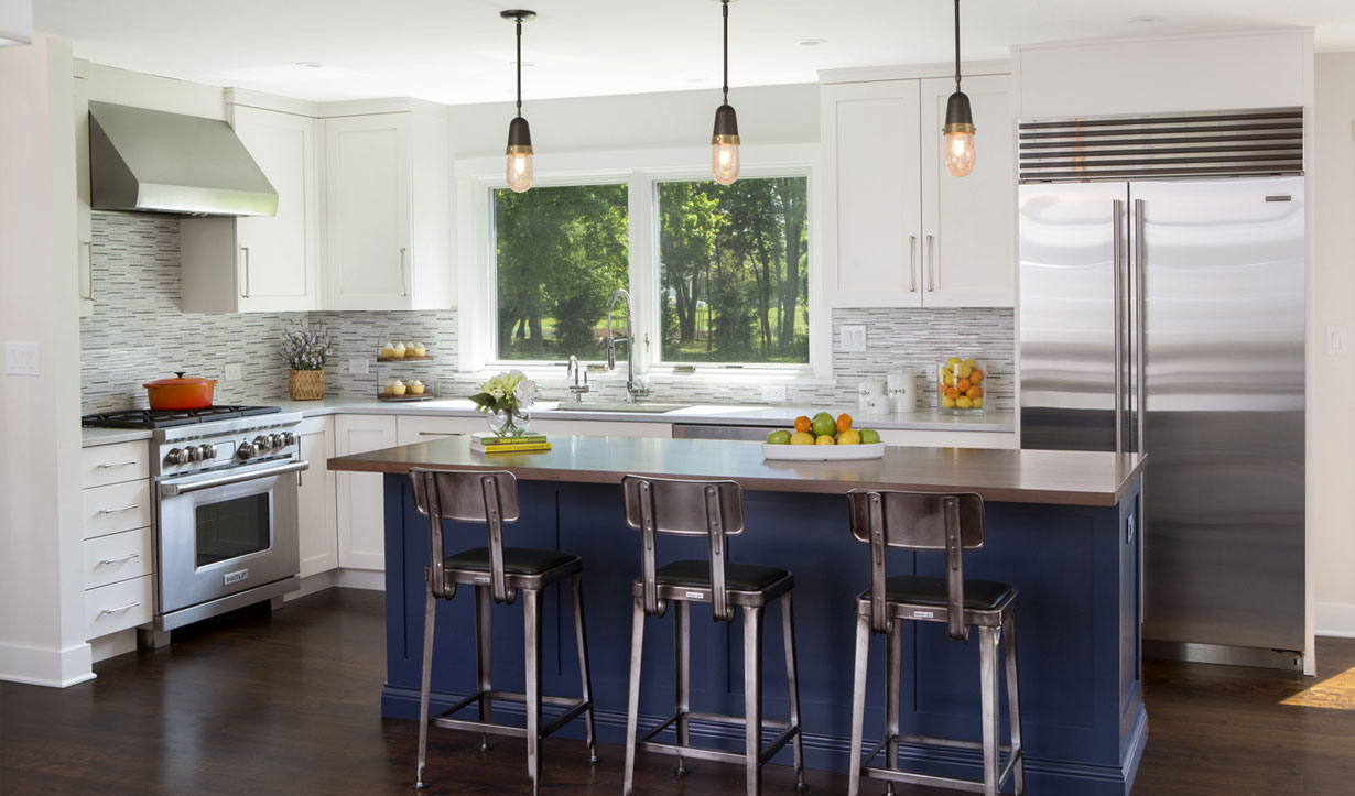 Navy blue kitchen island designed by building company Lasley Brahaney Architecture + Construction in Princeton, NJ